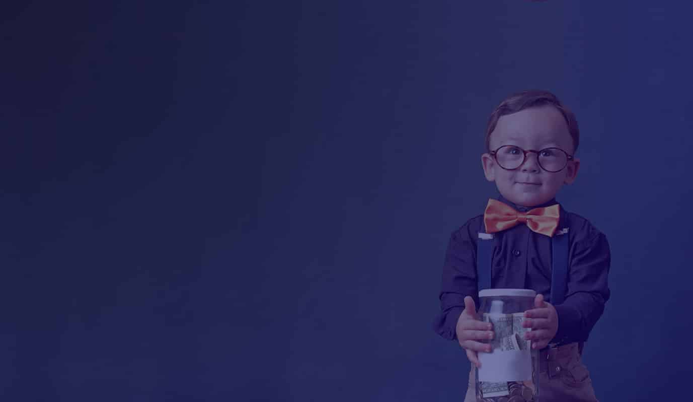 A child wearing glasses and a bow tie, holding a jar of bank notes